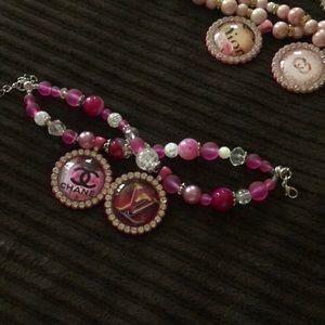 Hot pink and silver tone tray charms bracelet.